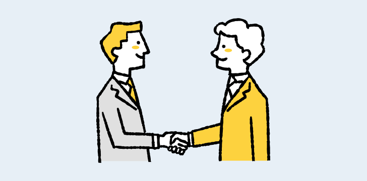 イラスト：向かい合い、握手している2人のスーツの男性社員